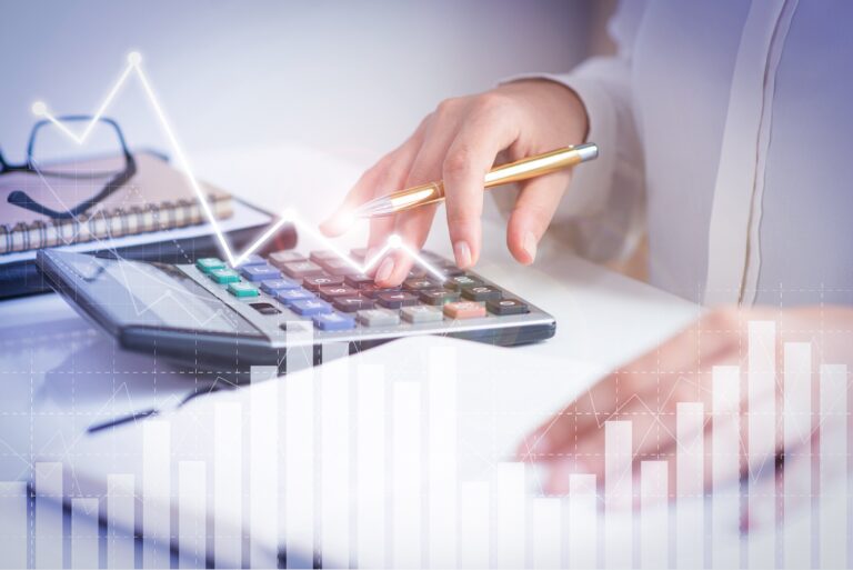 accountant calculating profit with financial analysis graphs 768x513